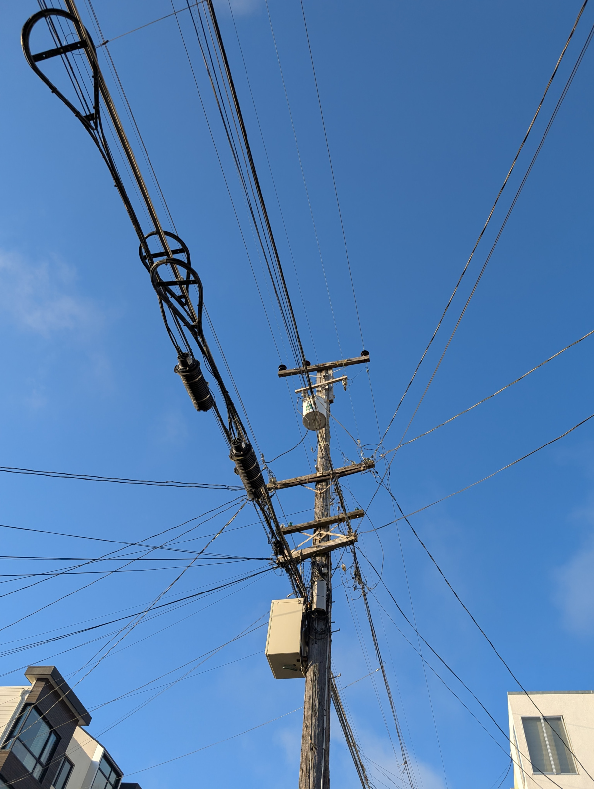 Close-up of utility pole connections
