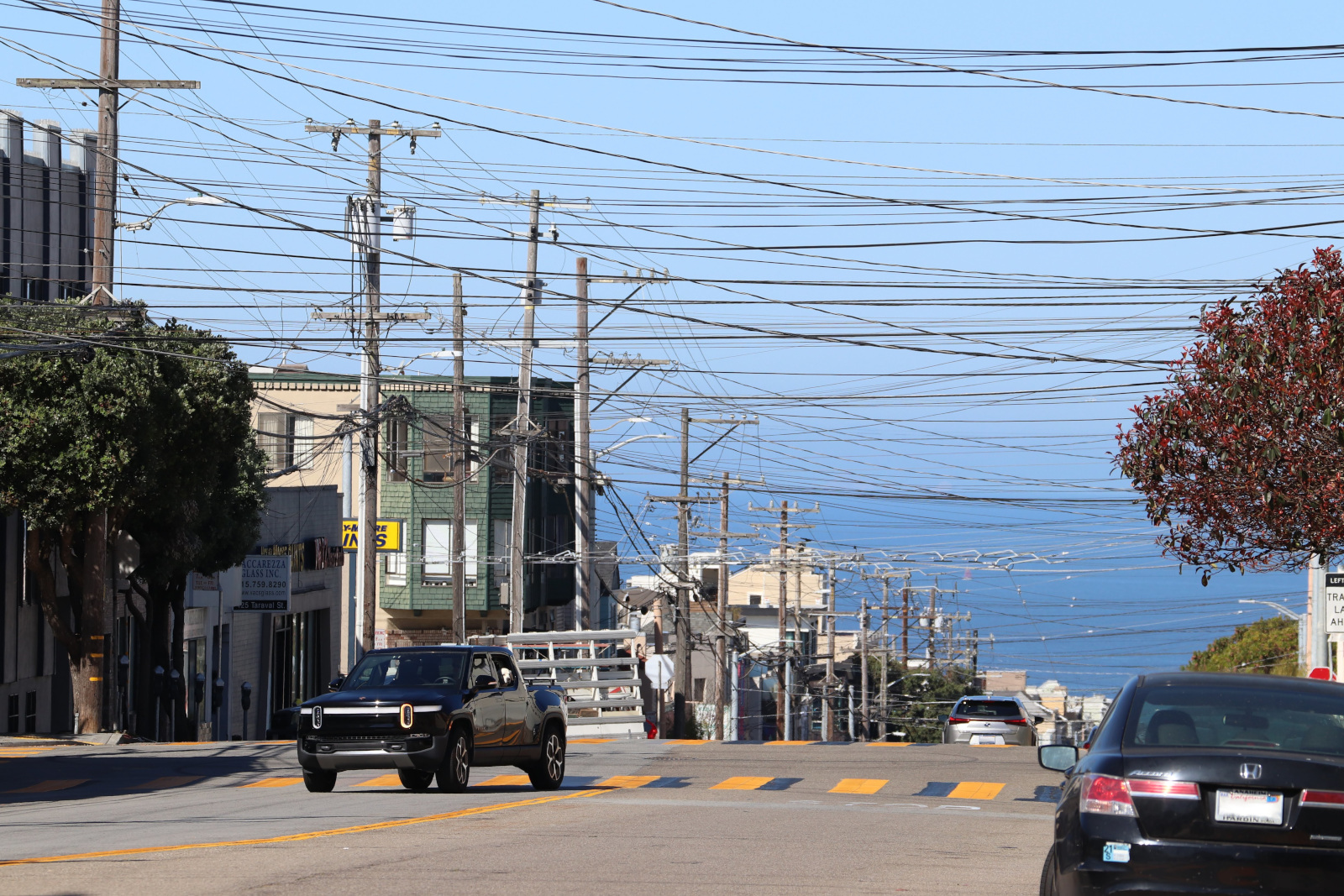 Multiple utility poles in a residential area